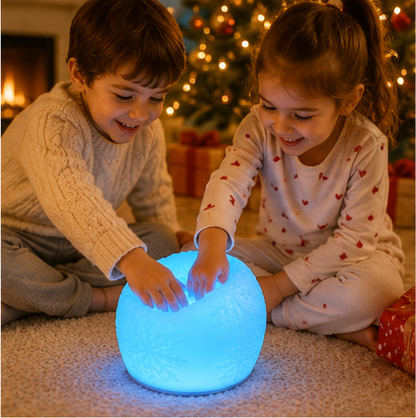 Child using WattBubble Christmas sensory light for tactile sensory play