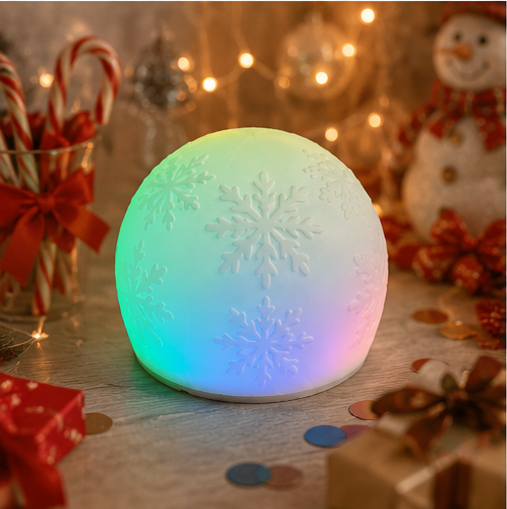Child squeezing WattBubble soft silicone Christmas sensory light